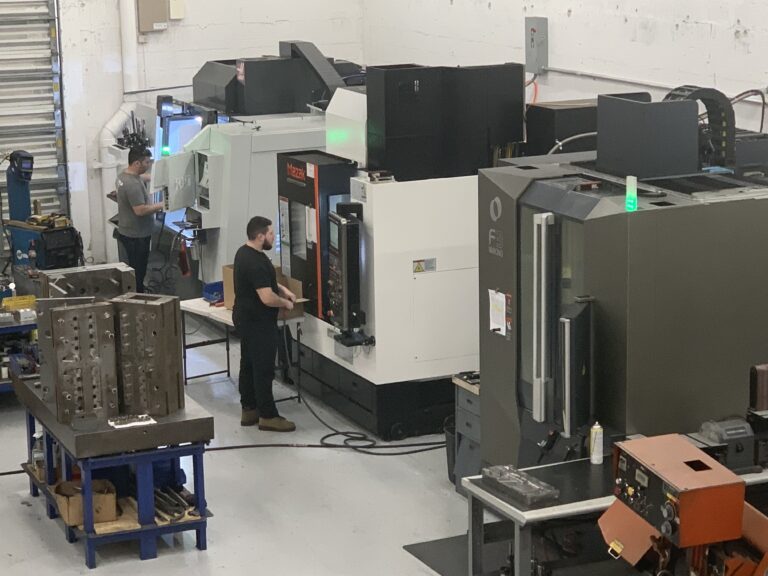CNC machining centers and mold tooling on the Plastimold production floor